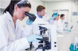 women looking into a microscope