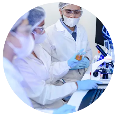Scientists in lab coats, masks, and gloves work at a microscope with glassware nearby in a modern lab sequence of tasks.
